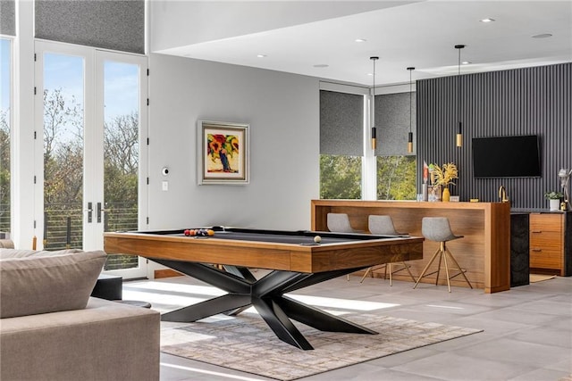 playroom featuring a healthy amount of sunlight, billiards, and bar area