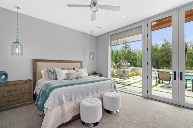 bedroom with access to exterior, french doors, ceiling fan, and carpet