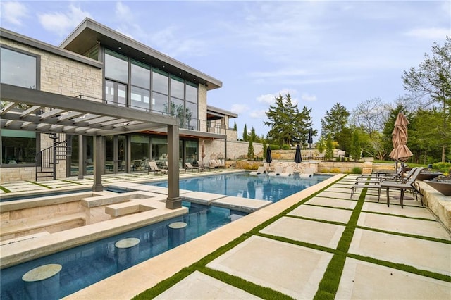 view of pool with a patio and a pergola