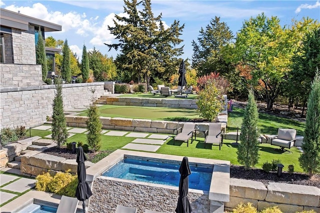 view of pool featuring a yard