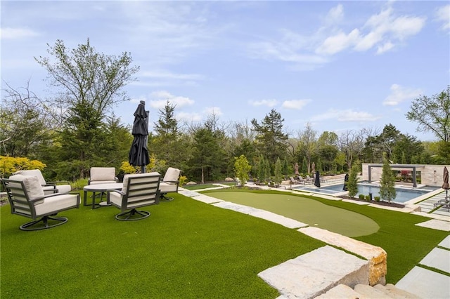 view of home's community with a swimming pool and a yard