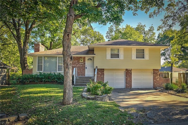 tri-level home with a front lawn and a garage