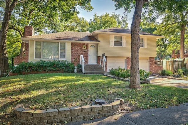 split level home featuring a front lawn and a garage