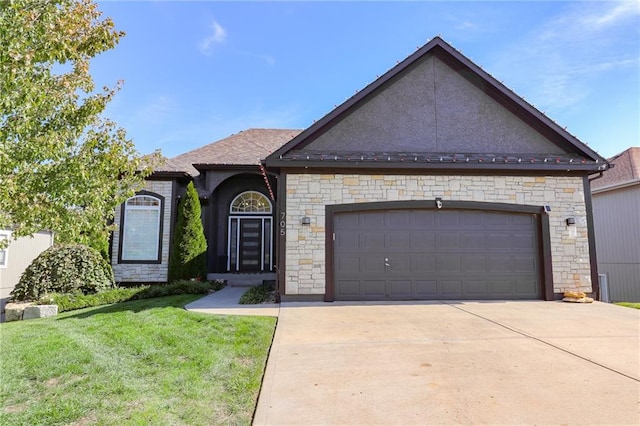 ranch-style home with a front yard and a garage