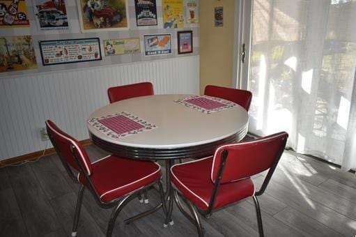 dining area with hardwood / wood-style floors