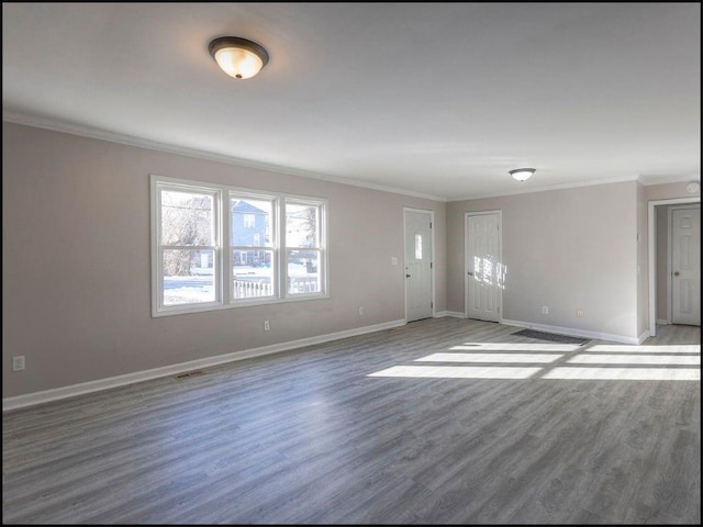 interior space featuring dark wood-type flooring and ornamental molding