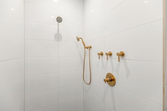 bathroom with a tile shower