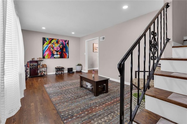 living room with dark hardwood / wood-style floors