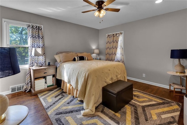 bedroom featuring dark wood-type flooring and ceiling fan