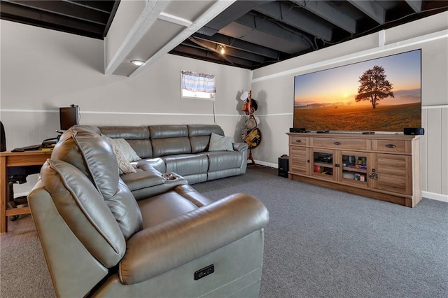 living room with beamed ceiling and dark carpet