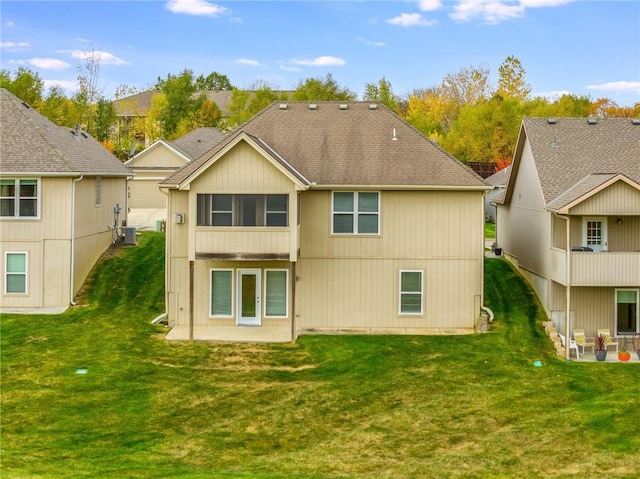 back of property featuring a yard, a patio area, and central AC unit