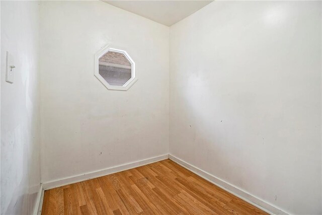 5121 Thompson Ave, Kansas City, MO 64124 - spare room with baseboards and light wood finished floors