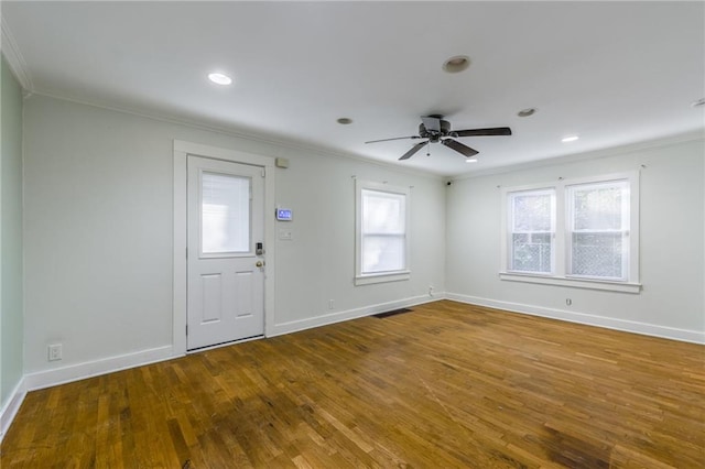 foyer with ornamental molding, wood-type flooring, and ceiling fan