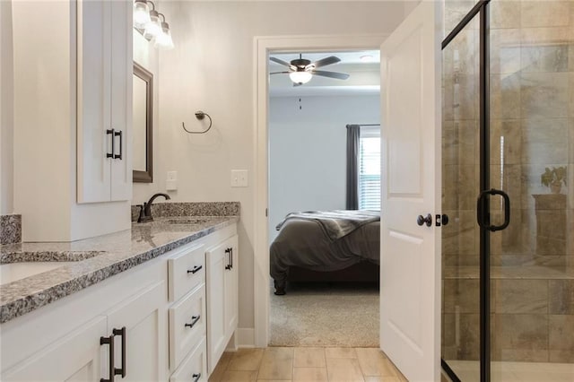 bathroom featuring vanity, an enclosed shower, tile patterned floors, and ceiling fan