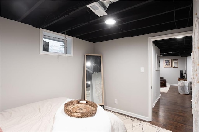 bedroom featuring dark hardwood / wood-style flooring