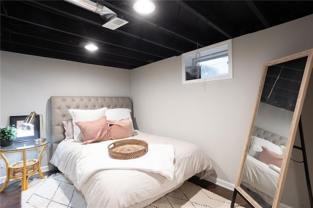 bedroom featuring wood-type flooring