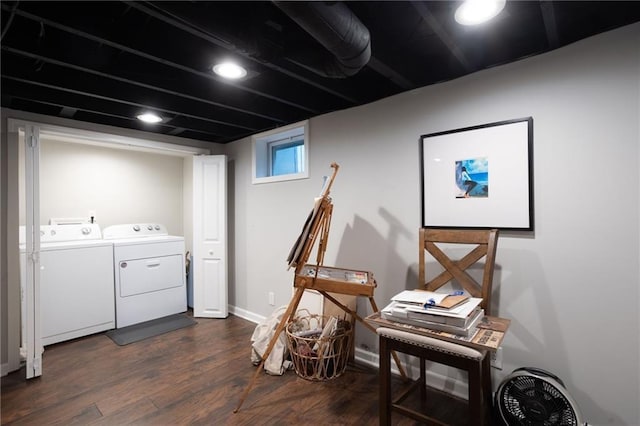 laundry room with washer and clothes dryer and dark hardwood / wood-style flooring