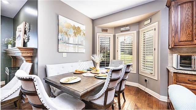 dining space featuring dark hardwood / wood-style floors