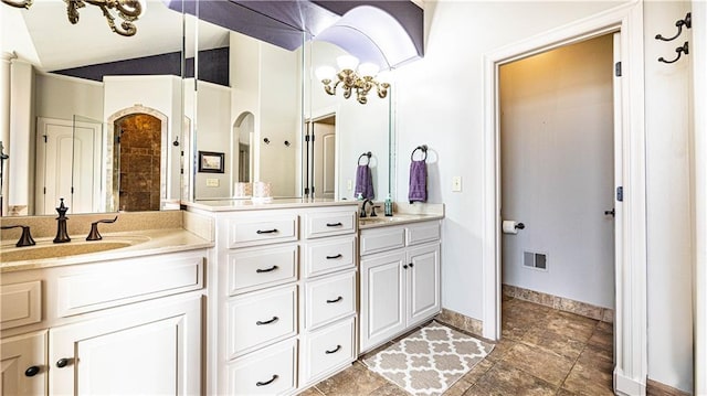 bathroom featuring vanity and vaulted ceiling