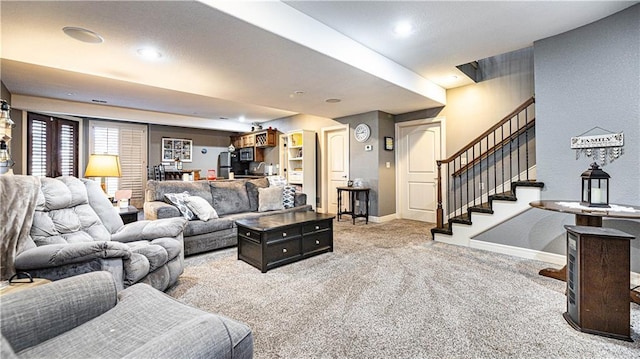 living room featuring light colored carpet