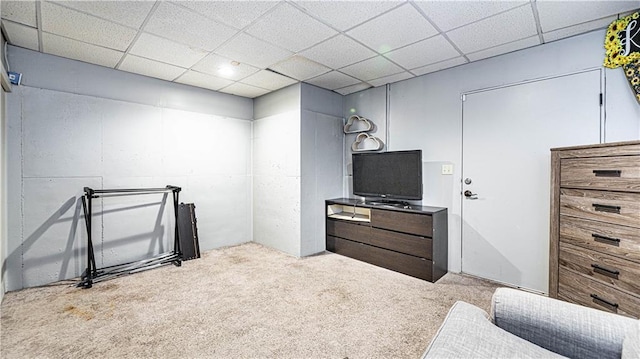 carpeted bedroom with a paneled ceiling