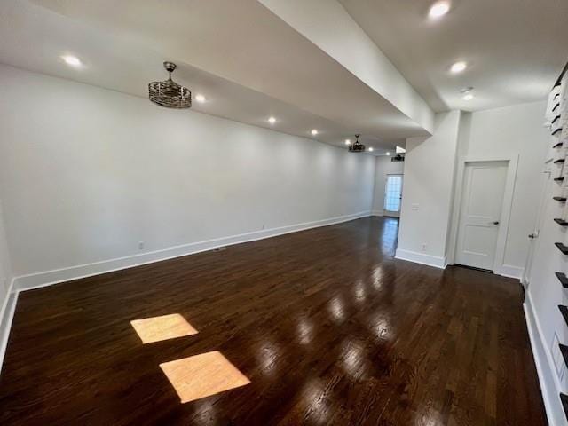 spare room with dark wood-type flooring