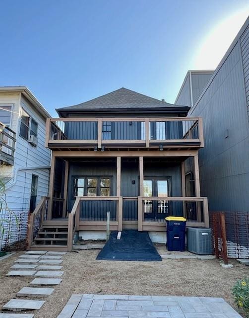 back of house featuring a balcony and central AC