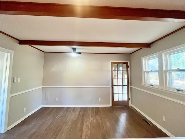 empty room featuring beam ceiling, dark hardwood / wood-style flooring, and ceiling fan