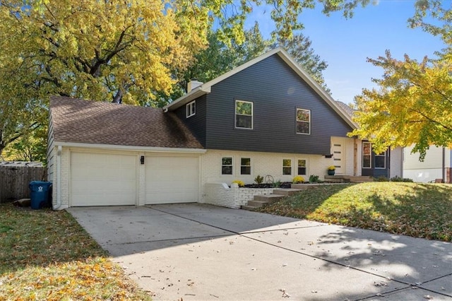 view of front facade featuring a front yard and a garage