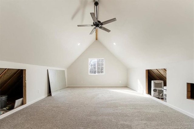 additional living space with vaulted ceiling, a ceiling fan, baseboards, and carpet floors