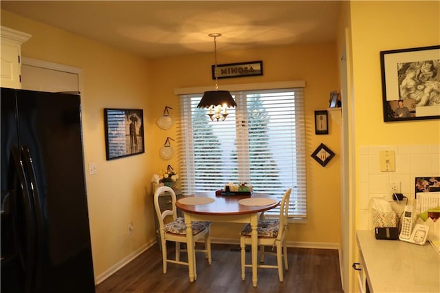 5850 Park Cir, Shawnee, KS 66216 - dining room featuring dark wood-type flooring and baseboards