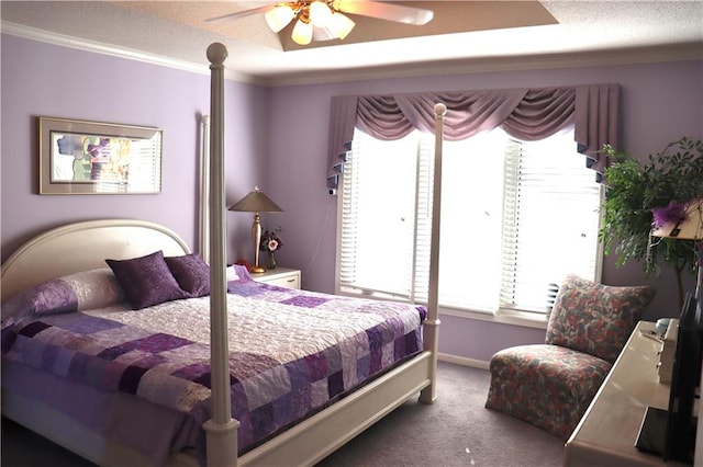 carpeted bedroom with ornamental molding and ceiling fan