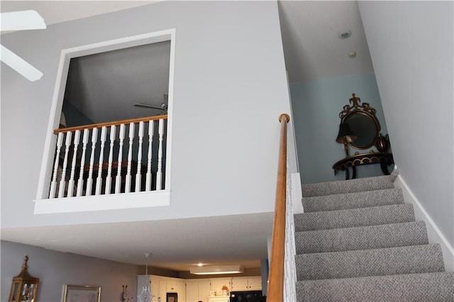 stairs with ceiling fan