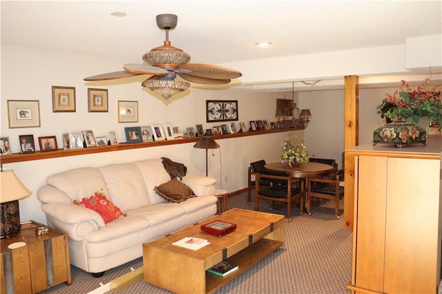 living room with ceiling fan and carpet floors