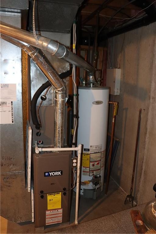 utility room featuring gas water heater