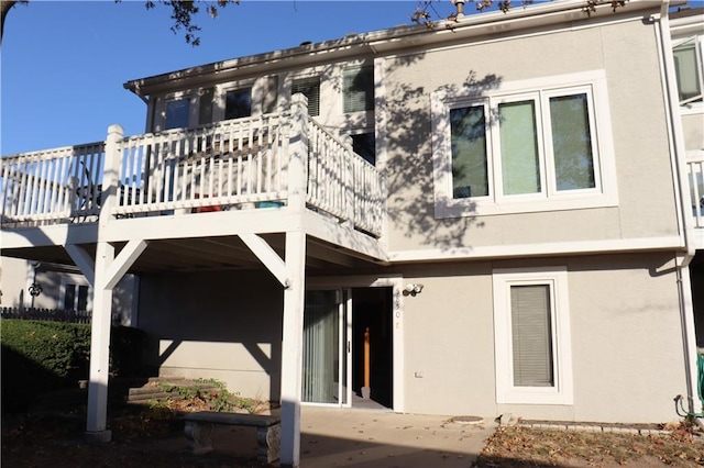 5850 Park Cir, Shawnee, KS 66216 - rear view of property with stucco siding and a patio