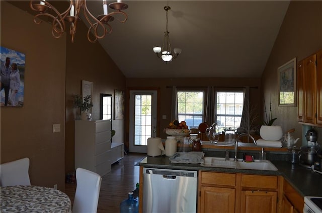 kitchen with dark wood-type flooring, stainless steel dishwasher, sink, and vaulted ceiling