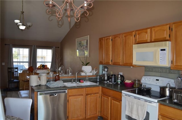 kitchen with lofted ceiling, a chandelier, pendant lighting, sink, and white appliances