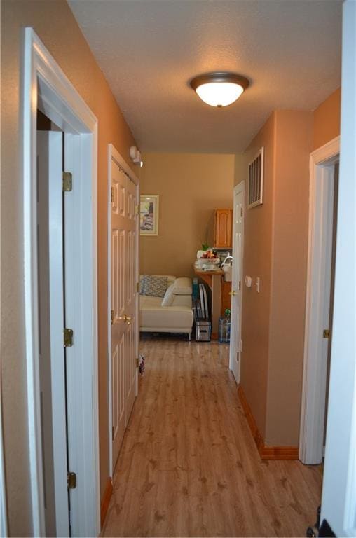 hall featuring light hardwood / wood-style floors