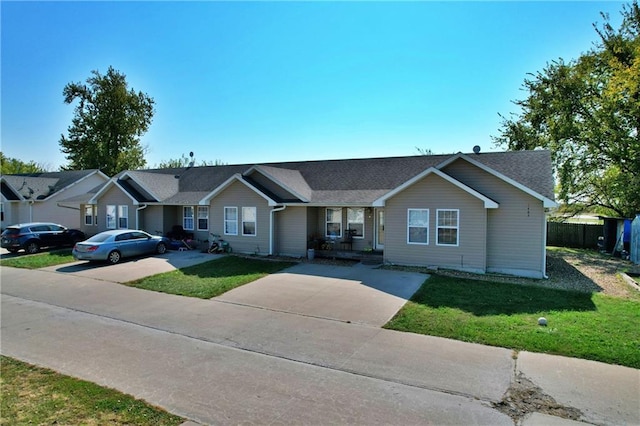 ranch-style house featuring a front lawn