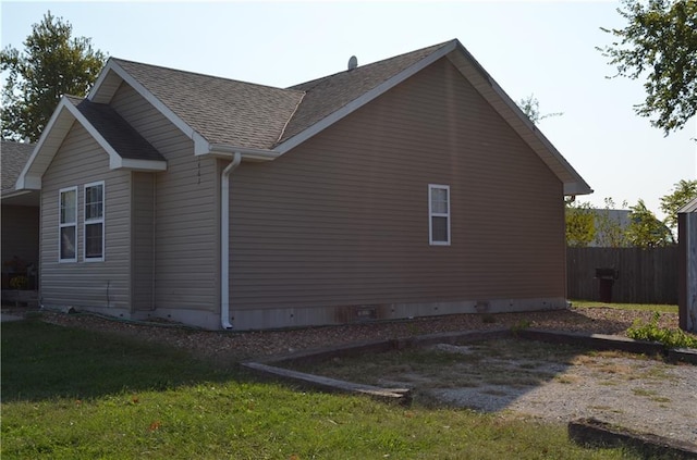 view of home's exterior featuring a lawn