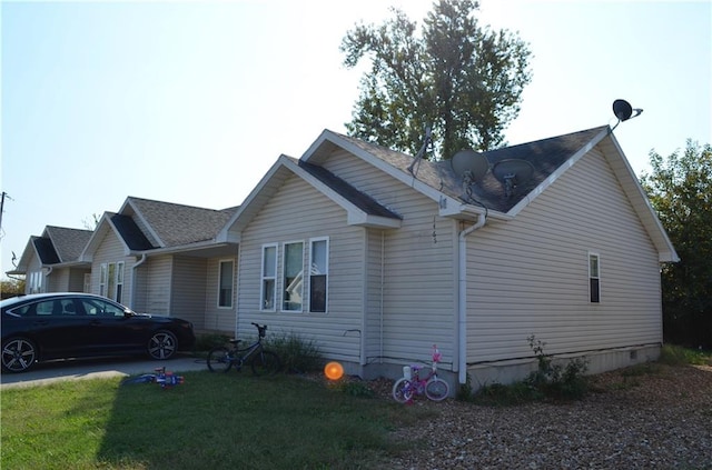 view of property exterior featuring a yard