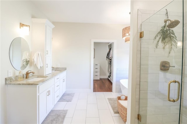 bathroom featuring vanity, tile patterned floors, and independent shower and bath