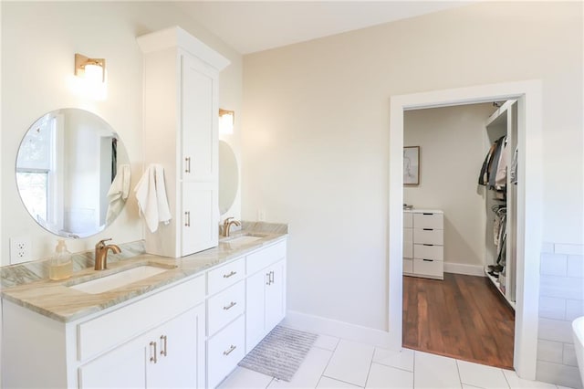 bathroom with vanity and tile patterned floors