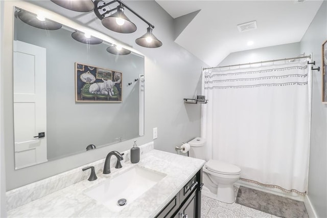 full bathroom featuring vanity, shower / bath combo with shower curtain, toilet, and tile patterned flooring