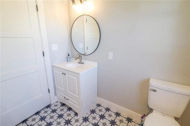 bathroom with toilet and vanity