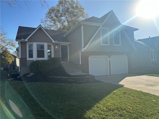 tri-level home with a front lawn and a garage