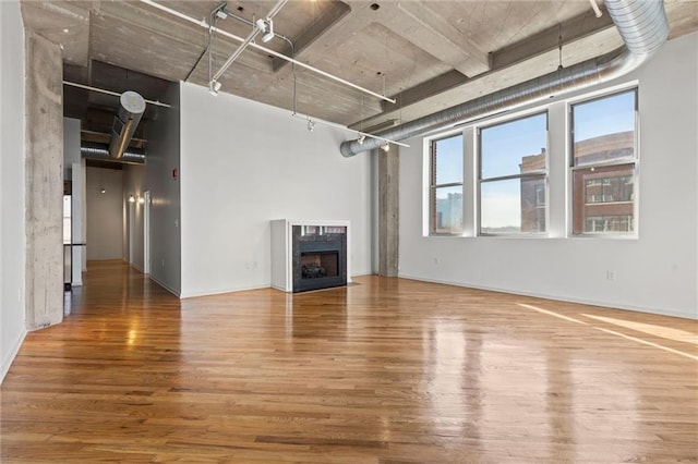 unfurnished living room with hardwood / wood-style flooring