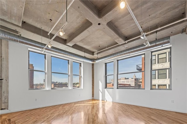 unfurnished room with hardwood / wood-style floors