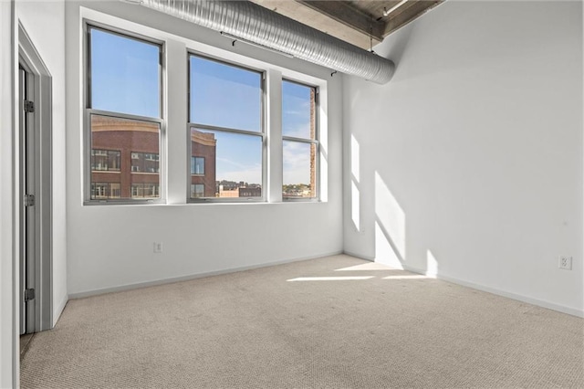 empty room with light colored carpet